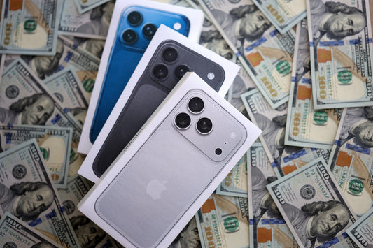 Assorted iPhone 11 and newer models displayed during evaluation at PayMore Cumberland